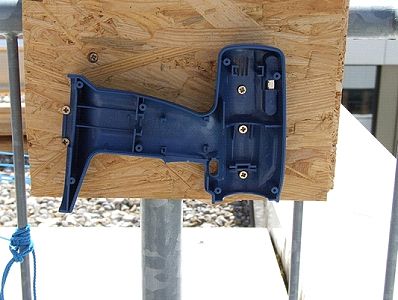 Half of screwdriver shell, affixed to railing mount plate